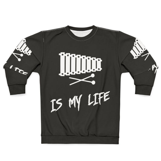 Person wearing a sweatshirt with the text "Xylophone Is My Life"