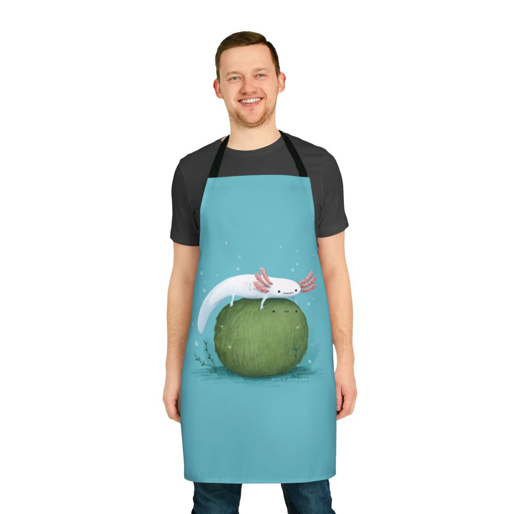 Illustration of a cute axolotl sitting on a green moss-covered ball, featured on a kitchen apron