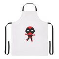 Cute baby wearing a superhero-themed apron