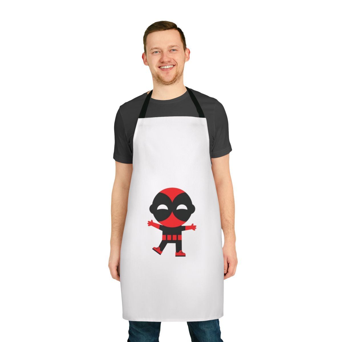 Cute baby wearing a superhero-themed apron