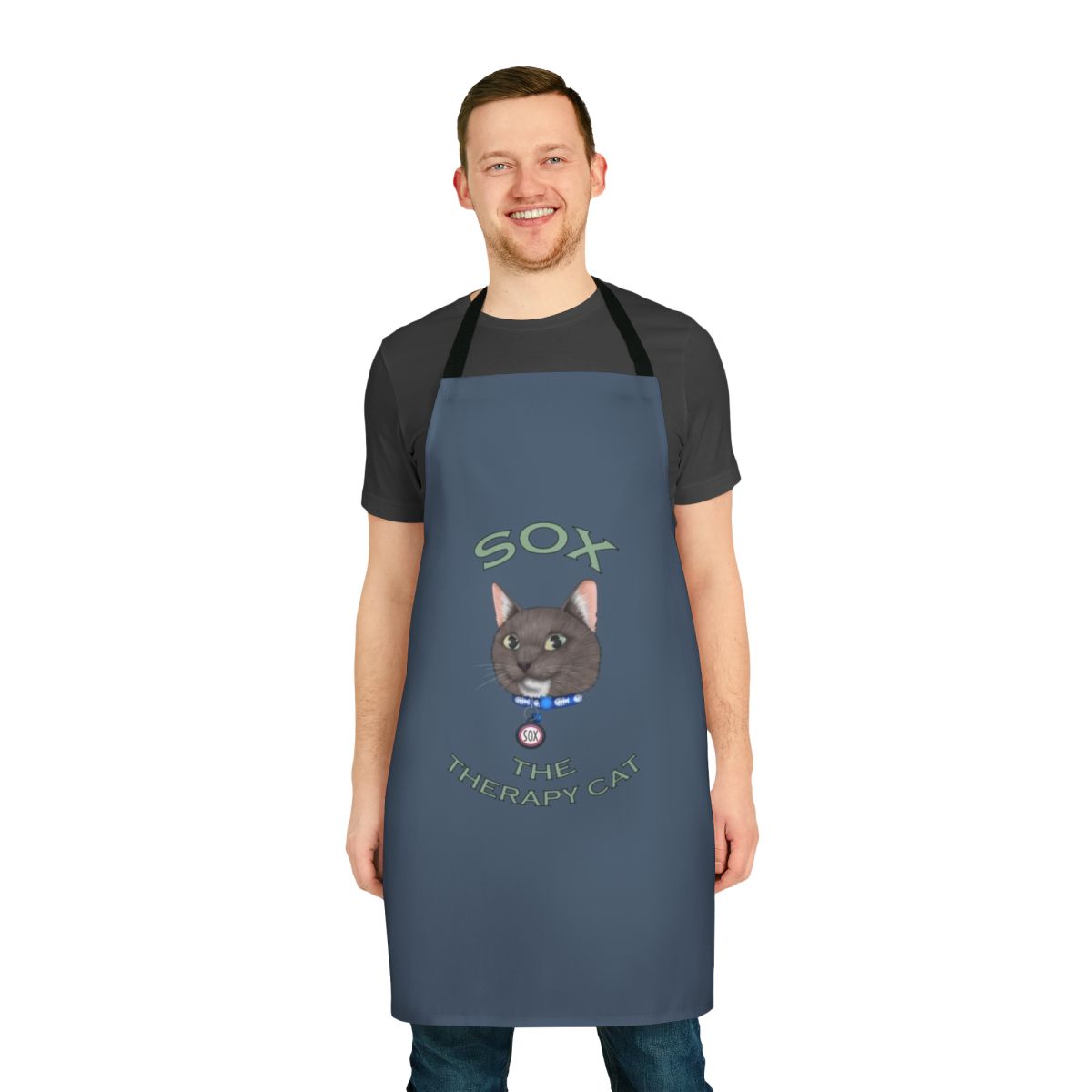Illustration of a cute, cartoon-style cat wearing a therapy cat vest on a black apron