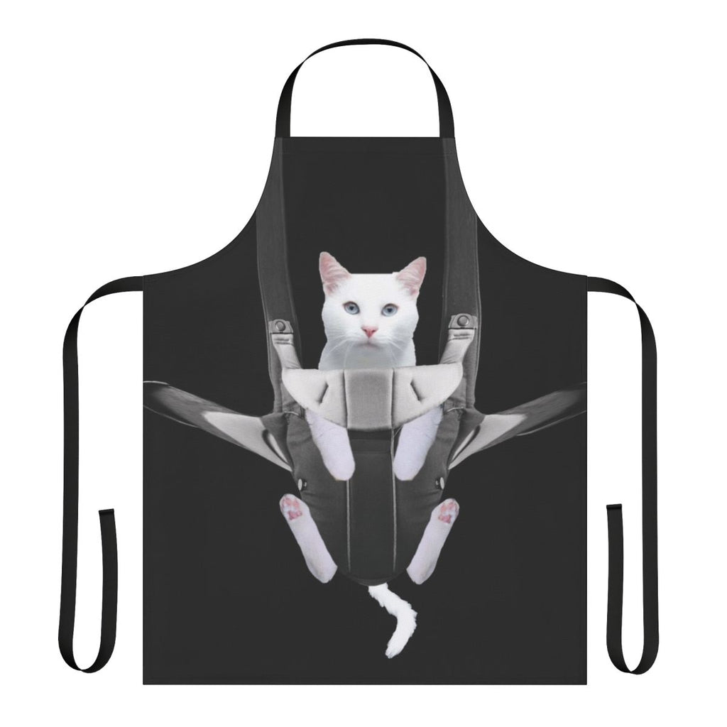 Cute tabby cat snuggled in a baby carrier apron