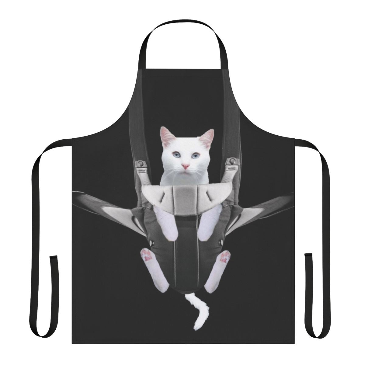 Cute tabby cat snuggled in a baby carrier apron