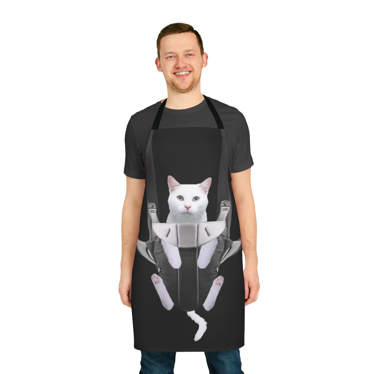 Cute tabby cat snuggled in a baby carrier apron