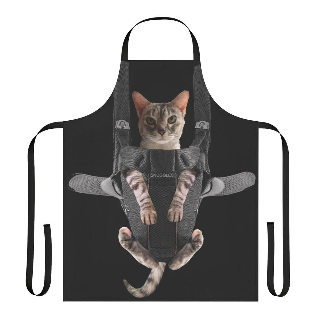 Cute gray cat sitting in a baby carrier attached to a gray apron