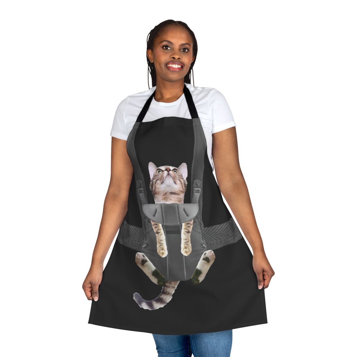 Tabby cat sitting in a baby carrier attached to an apron