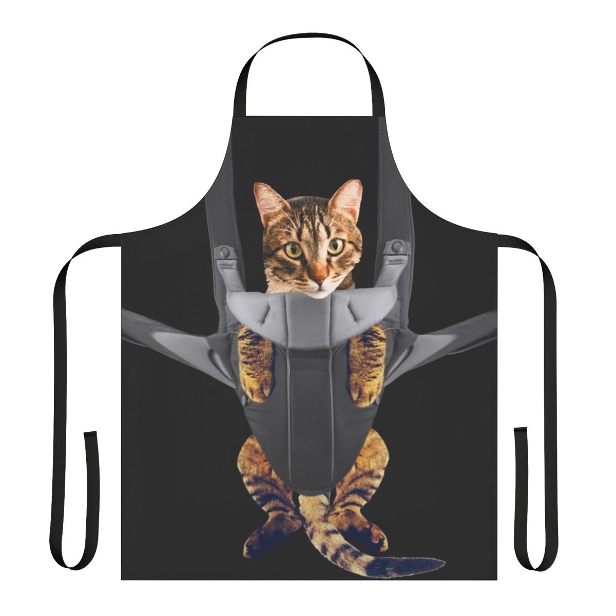 Tabby cat cozily nestled in a baby carrier-style apron, creating a humorous and heartwarming image.