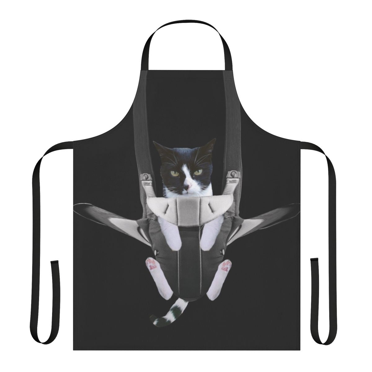 A cat snuggled inside a baby carrier-style apron