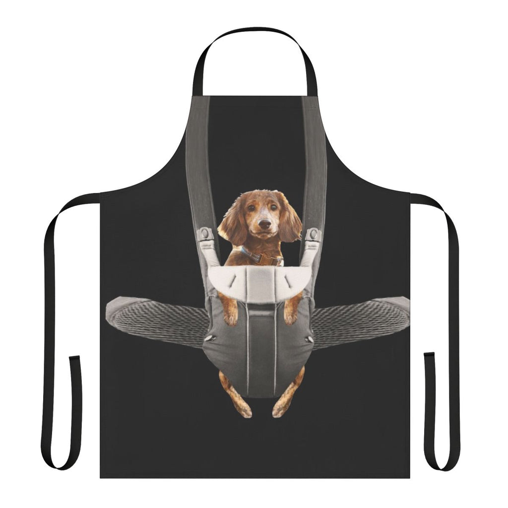 A dachshund dog sitting in a baby carrier, printed on an apron for dog owners and pet parents
