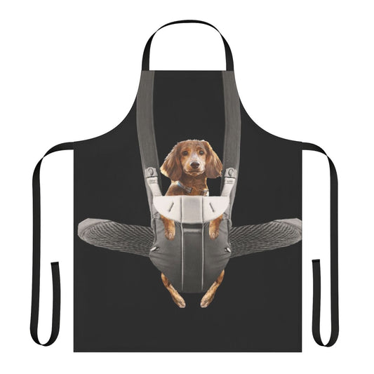A dachshund dog sitting in a baby carrier, printed on an apron for dog owners and pet parents