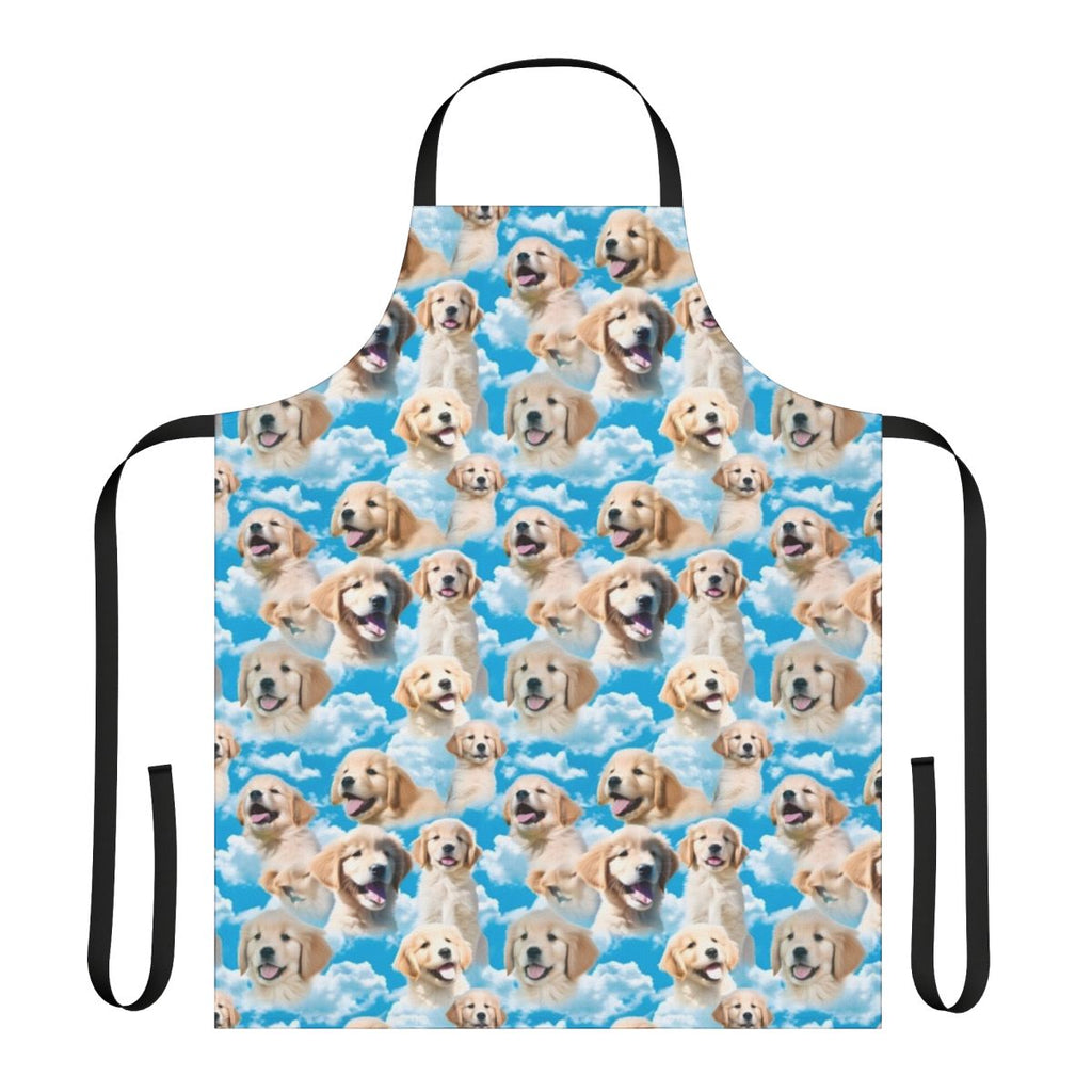 Golden retriever puppy wearing an apron against a blue sky background