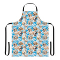 Golden retriever puppy wearing an apron against a blue sky background