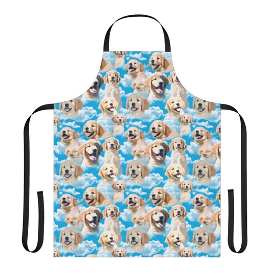 Golden retriever puppy wearing an apron against a blue sky background