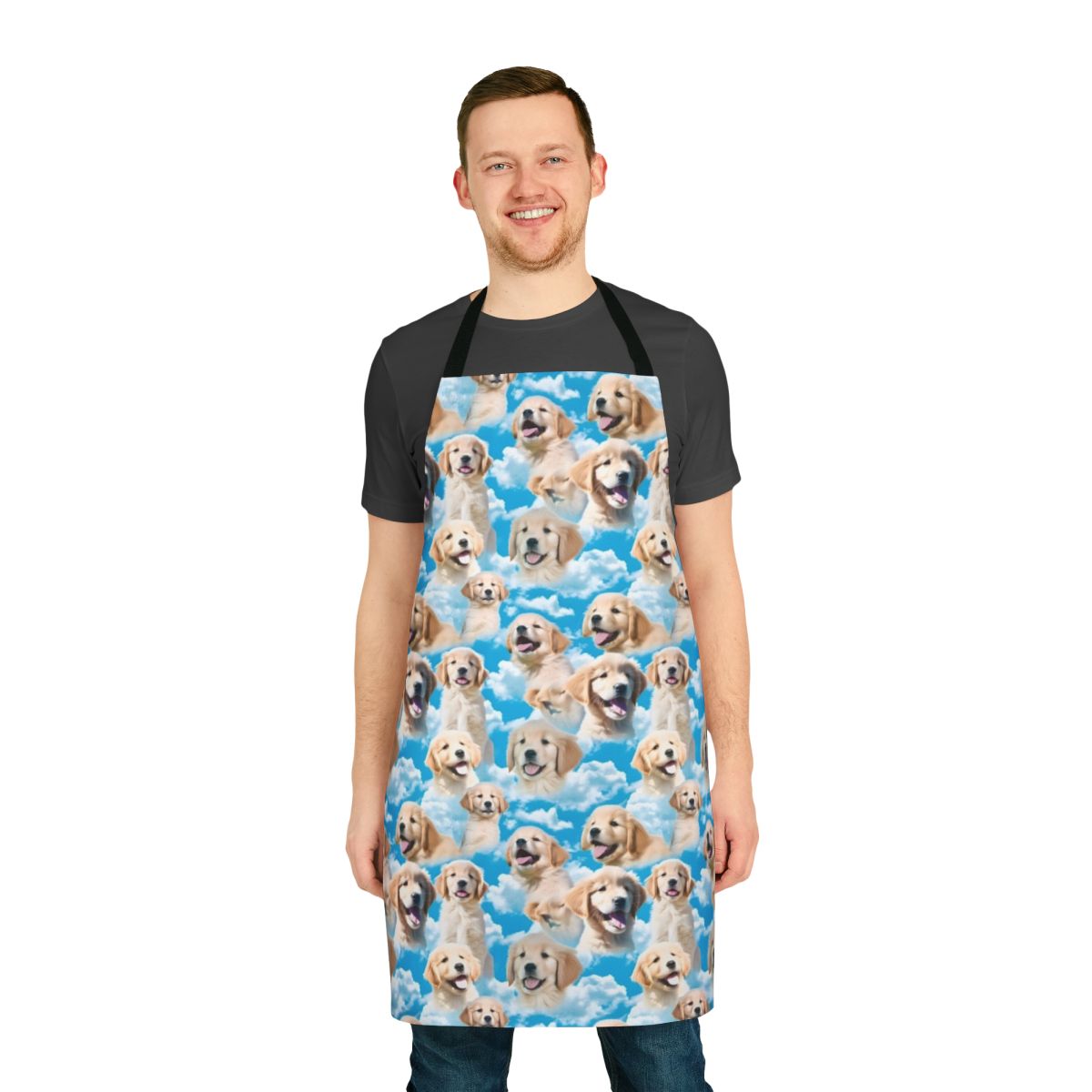 Golden retriever puppy wearing an apron against a blue sky background