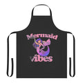 A vibrant pink apron featuring a whimsical mermaid design, perfect for mermaid lovers.