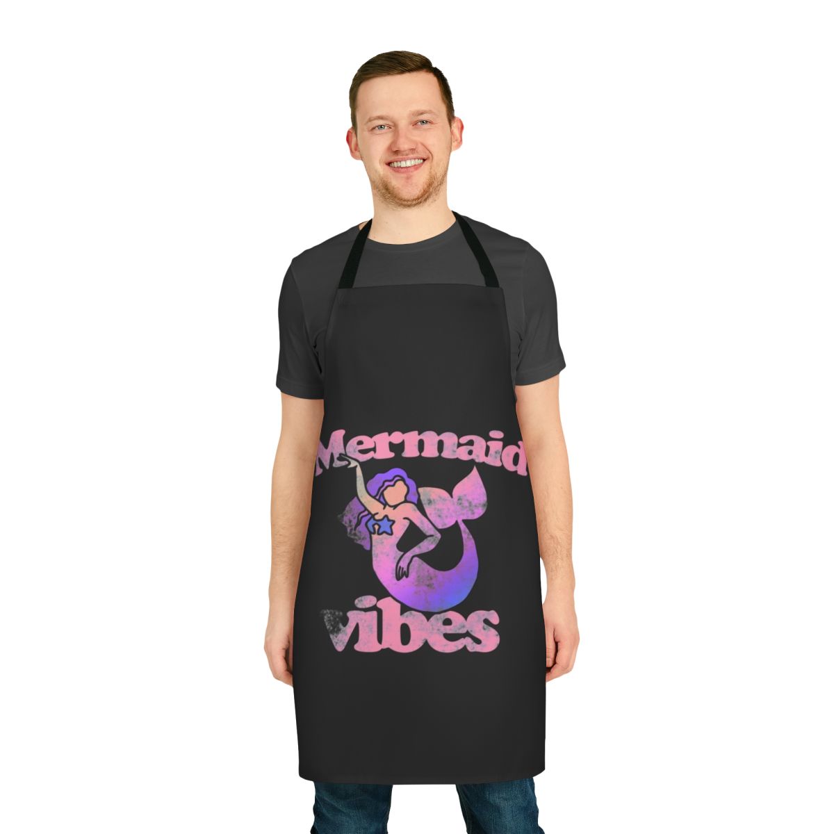 A vibrant pink apron featuring a whimsical mermaid design, perfect for mermaid lovers.