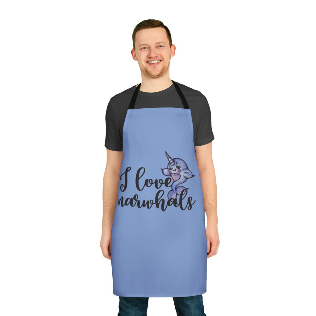 "A vibrant purple and pink apron featuring a cute narwhal design, perfect for fans of these legendary marine animals."