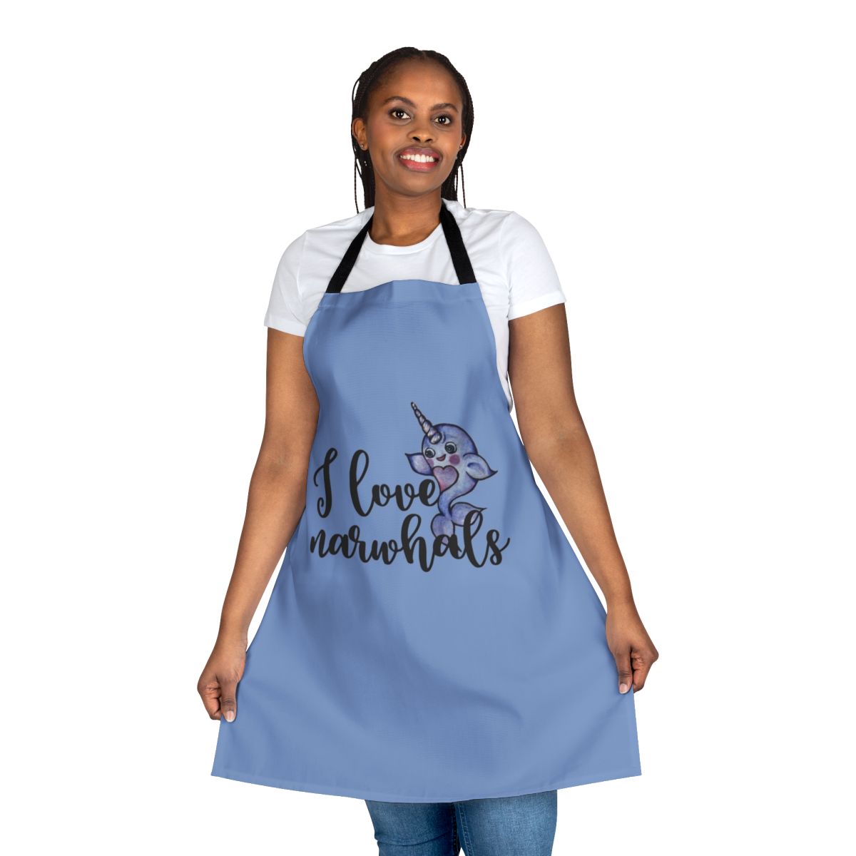 "A vibrant purple and pink apron featuring a cute narwhal design, perfect for fans of these legendary marine animals."