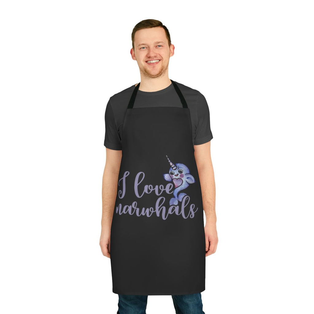 A purple and pink apron with a cute narwhal design, ideal for cooking and baking enthusiasts.