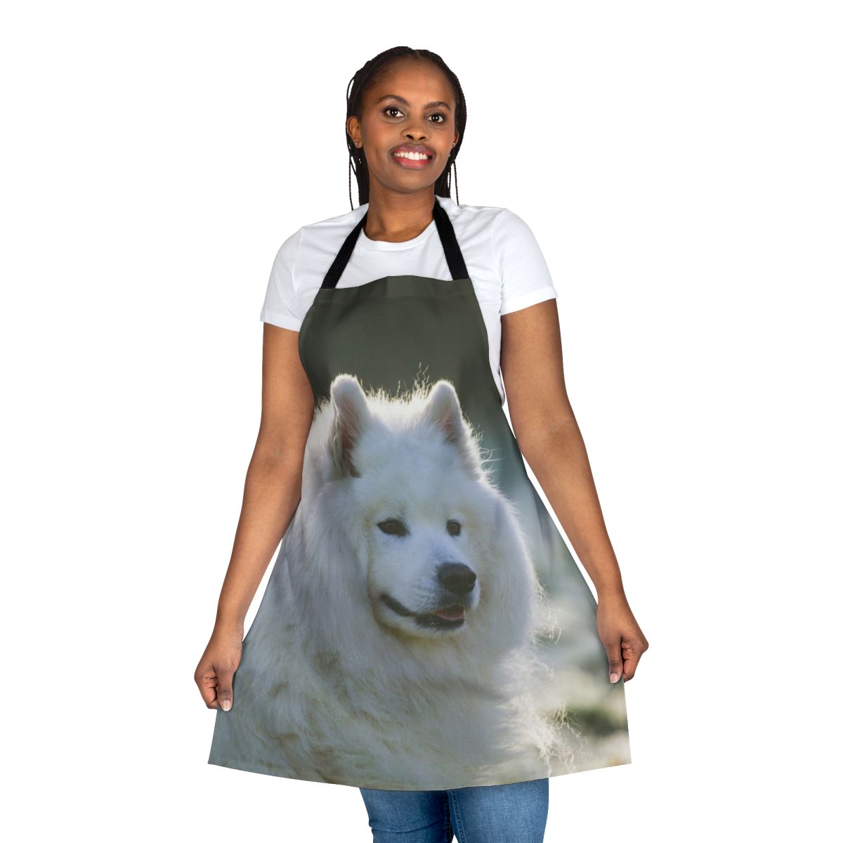 A white fluffy Samoyed dog wearing an apron with a smiling expression