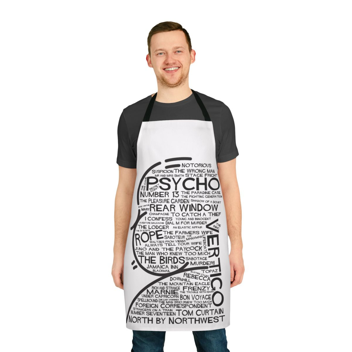 An apron featuring fan art inspired by the film titles of director Alfred Hitchcock, including Vertigo, Psycho, Rope, North by Northwest, and Number 13.