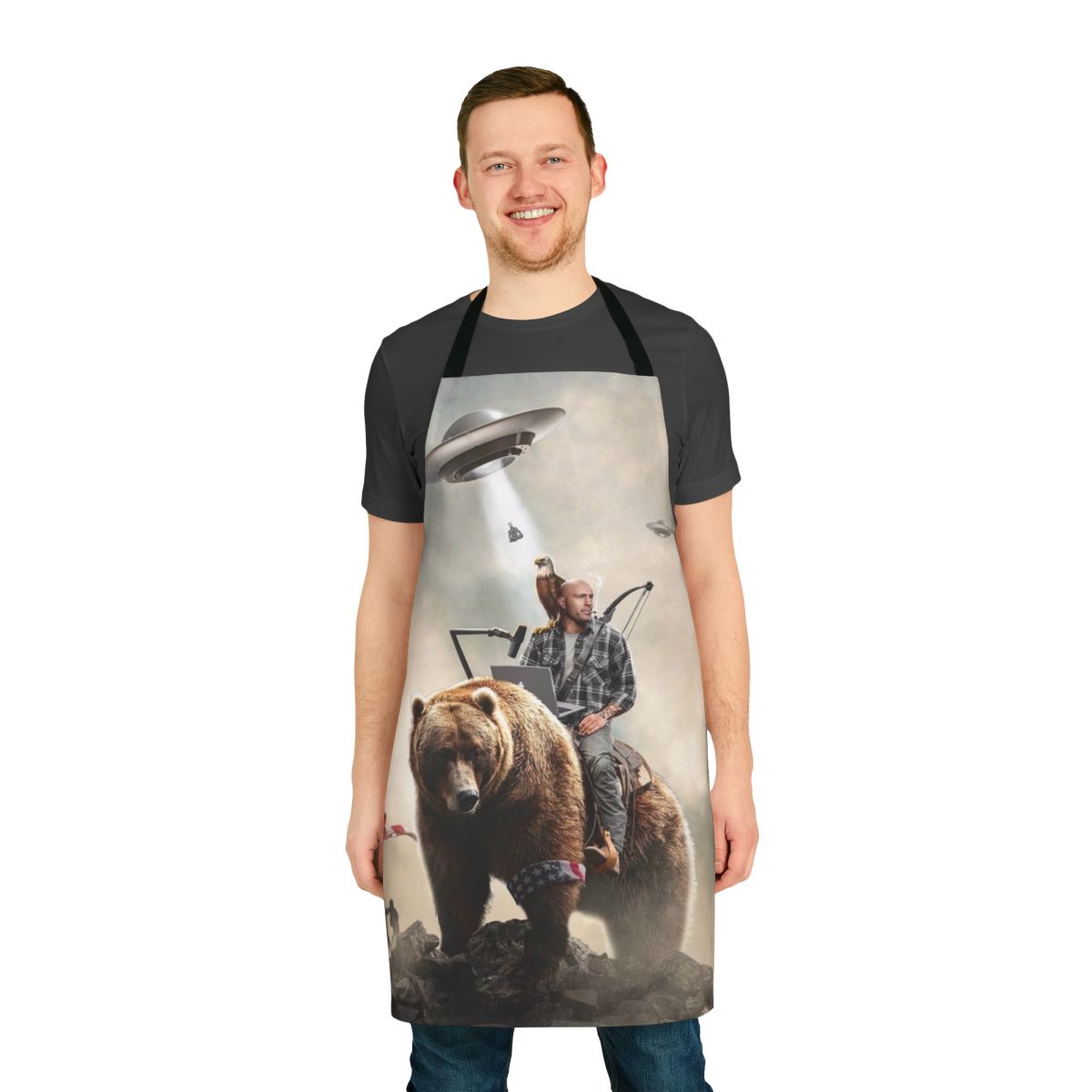 An apron featuring an illustration of Joe Rogan riding a bear in an alien landscape.