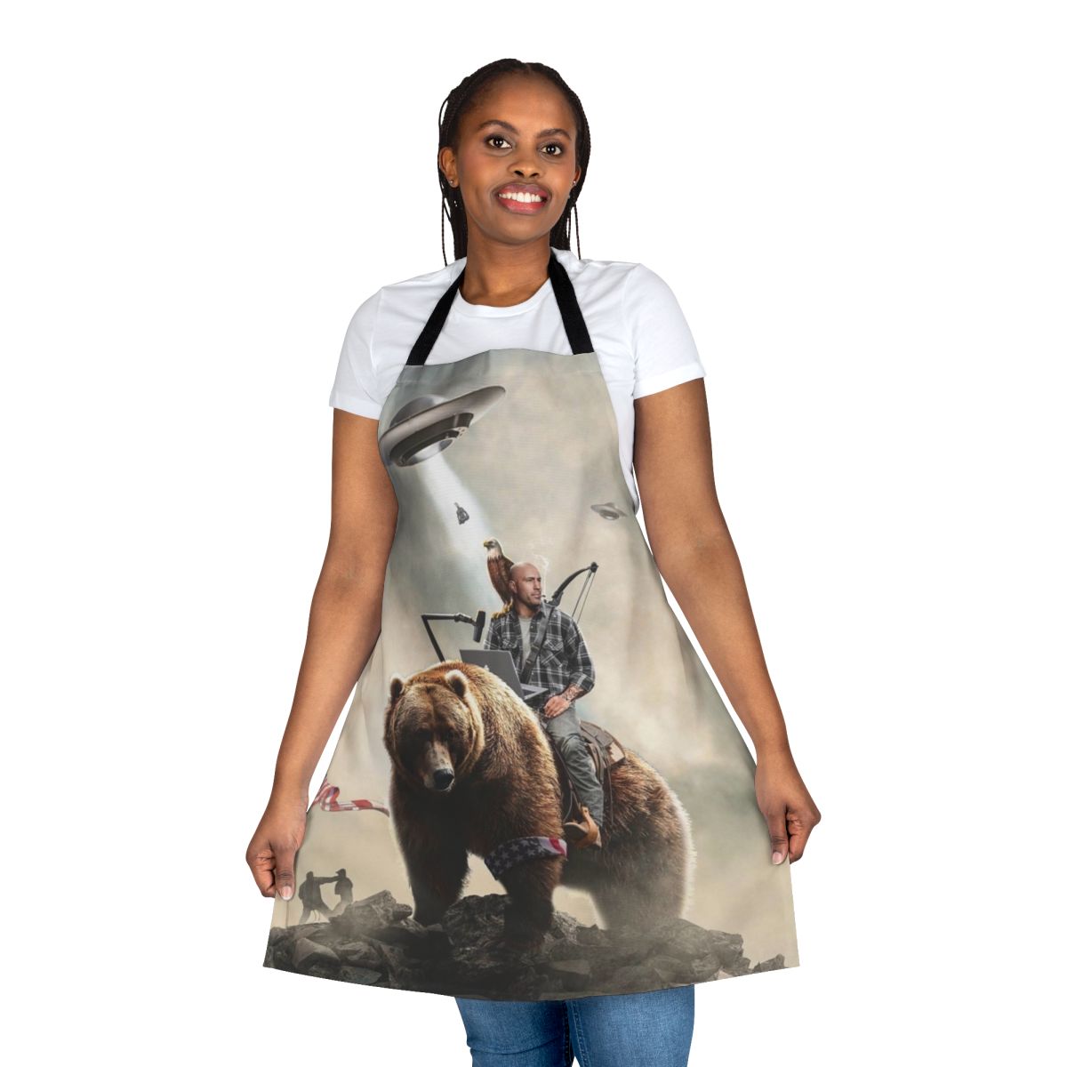 An apron featuring an illustration of Joe Rogan riding a bear in an alien landscape.