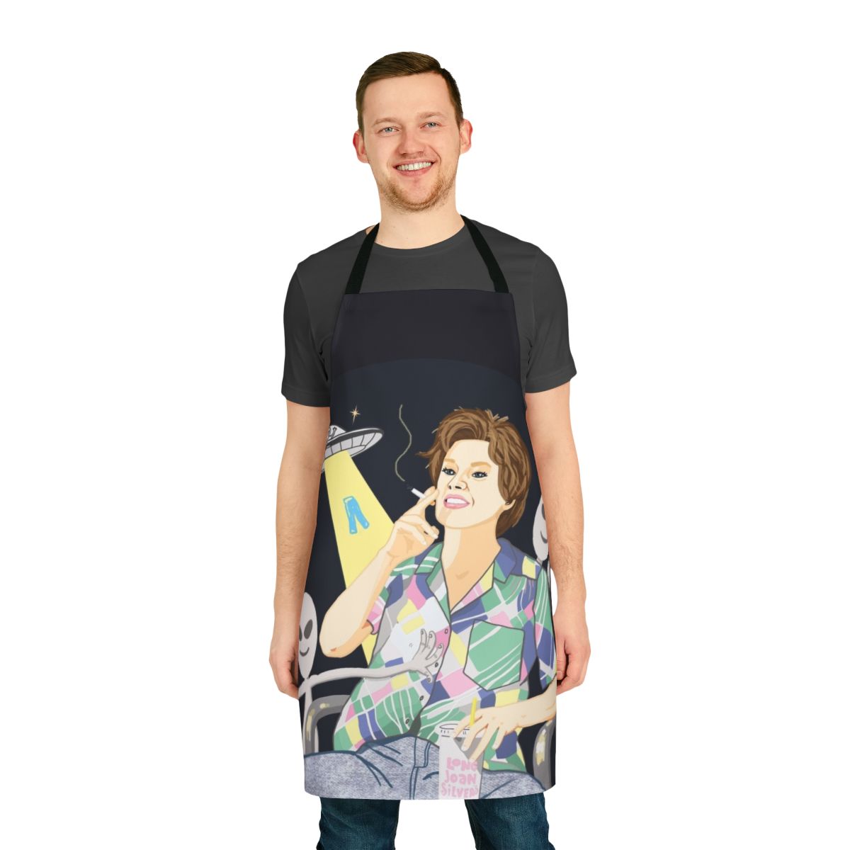 Alien-themed apron featuring Kate McKinnon's iconic "Ms. Rafferty" character from Saturday Night Live's "Alien Encounter" sketch.