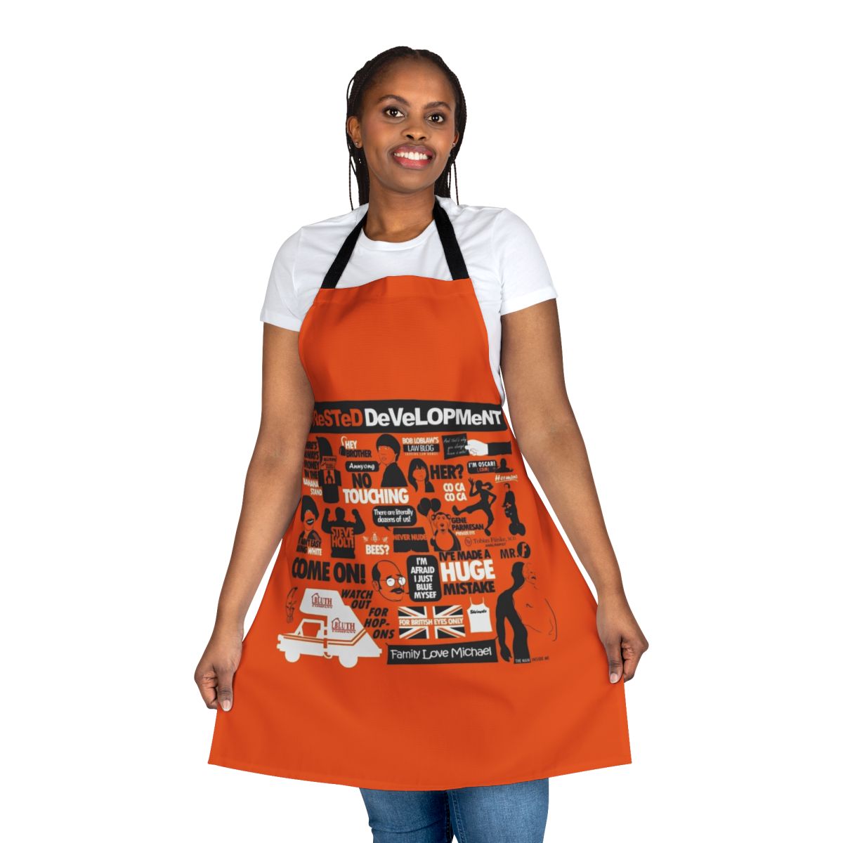 Model wearing an Arrested Development-themed apron with comedy and pop culture references.