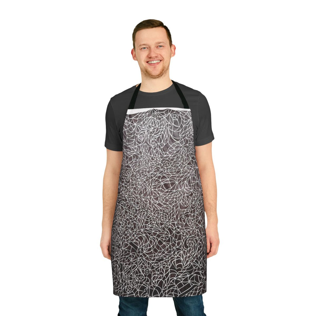 Apron featuring a black and white pattern design with music notes, treble and bass clefs