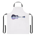 Artistic nature-inspired guitar apron with a minimalist design featuring trees, water, and musical elements.