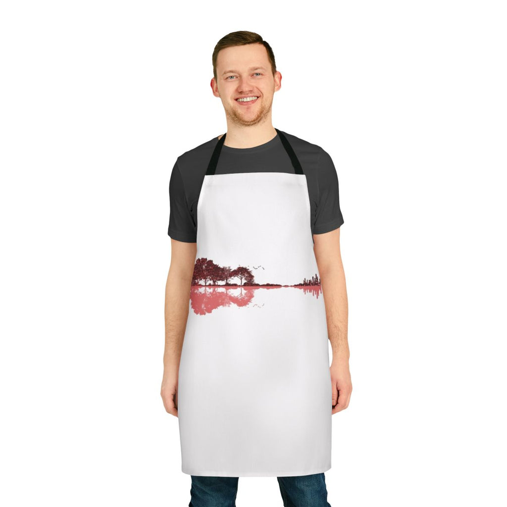 Stylized apron featuring a nature silhouette, guitar, and musical notes in a red and black color scheme