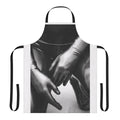 Artsy photograph of a person wearing a black and white latex gloves apron with a shallow depth of field.
