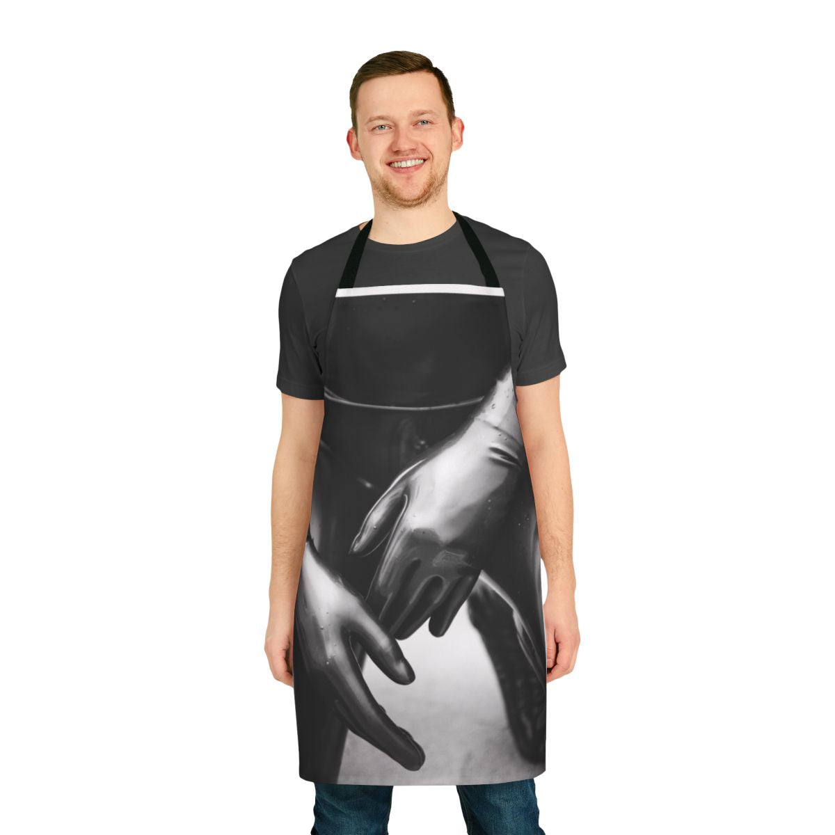 Artsy photograph of a person wearing a black and white latex gloves apron with a shallow depth of field.