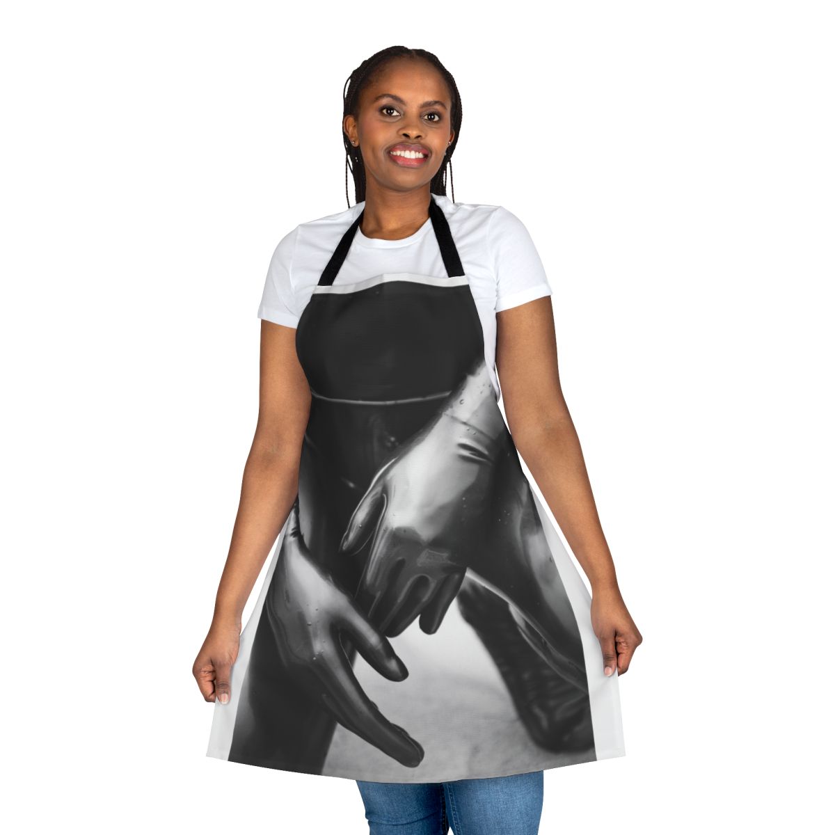 Artsy photograph of a person wearing a black and white latex gloves apron with a shallow depth of field.