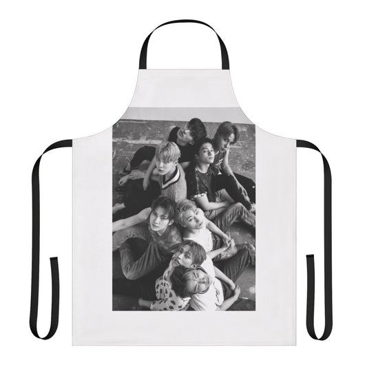 ATEEZ members featured on a custom-designed apron inspired by the group's Dazed magazine photoshoot.