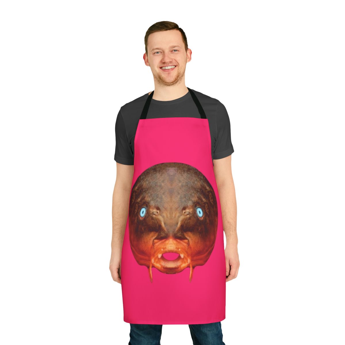 Avant-garde kitchen apron featuring a surreal trout mask replica design, inspired by the experimental music of Captain Beefheart and the Magic Band.