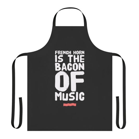 A funny apron featuring the text "French Horn is the Bacon of Music" on a black background.