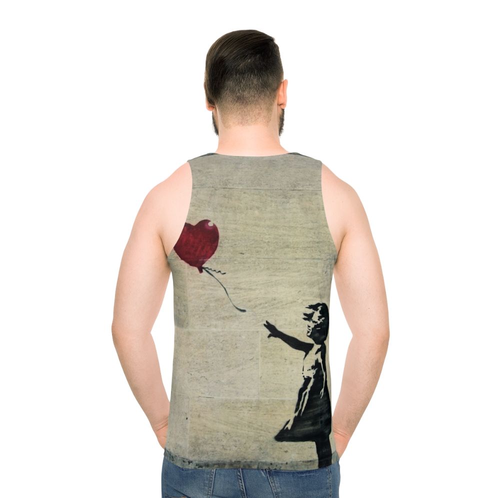 Banksy's iconic "Girl with a Red Balloon" street art design on a unisex tank top