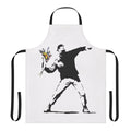 A durable cotton apron featuring a stencil design inspired by the iconic "Flower Thrower" street art by Banksy.
