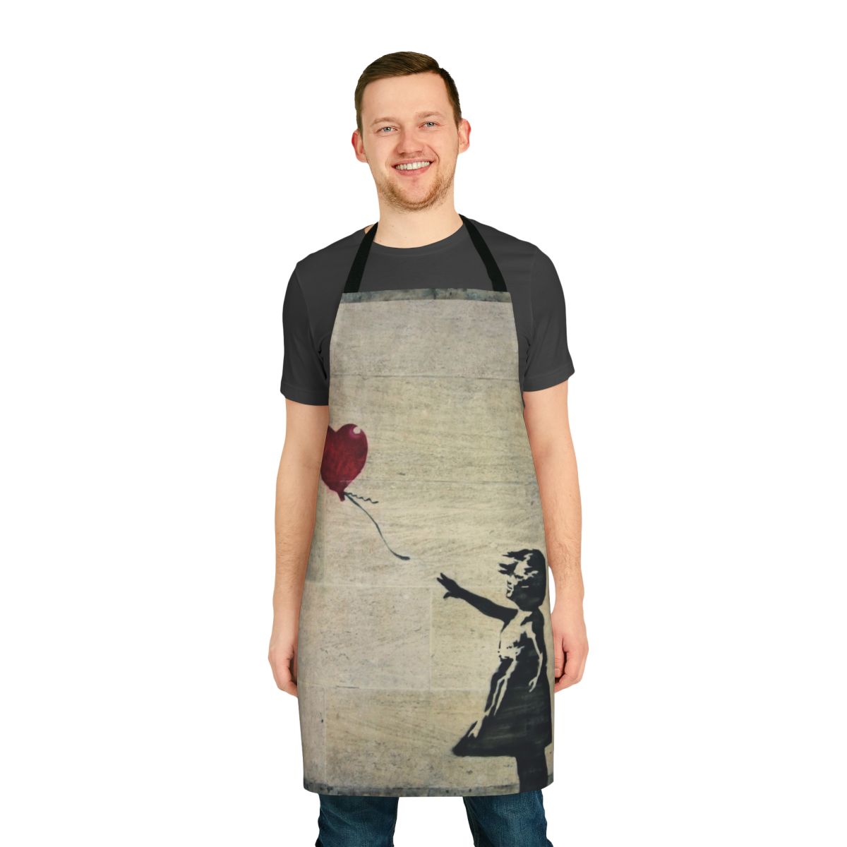 Apron featuring a stencil-style design inspired by Banksy's iconic "Girl with a Red Balloon" artwork