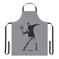 "A stylish and durable apron featuring the iconic Banksy-inspired graffiti 'Rage Flower Thrower' design"