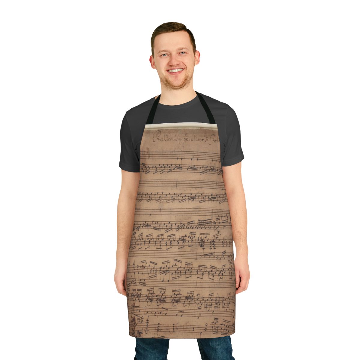 An apron featuring a baroque-style musical manuscript design with treble and bass clefs.