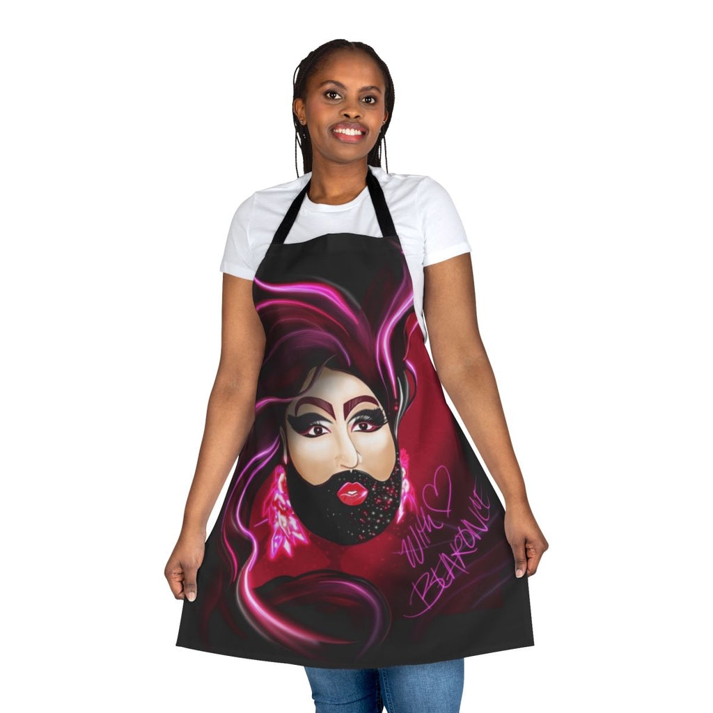 Bearded lady drag queen wearing a custom designed apron with LGBTQ+ fan art