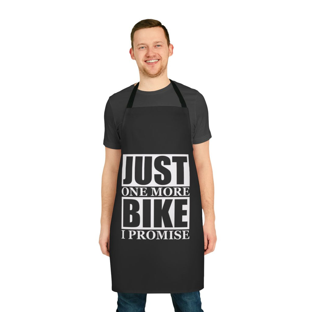 A durable, high-quality apron with the humorous phrase "Just One More Bike I Promise" printed on it, perfect for bike enthusiasts.