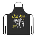 A black cooking apron featuring a heart dagger design, inspired by the Bon Jovi album "Slippery When Wet"