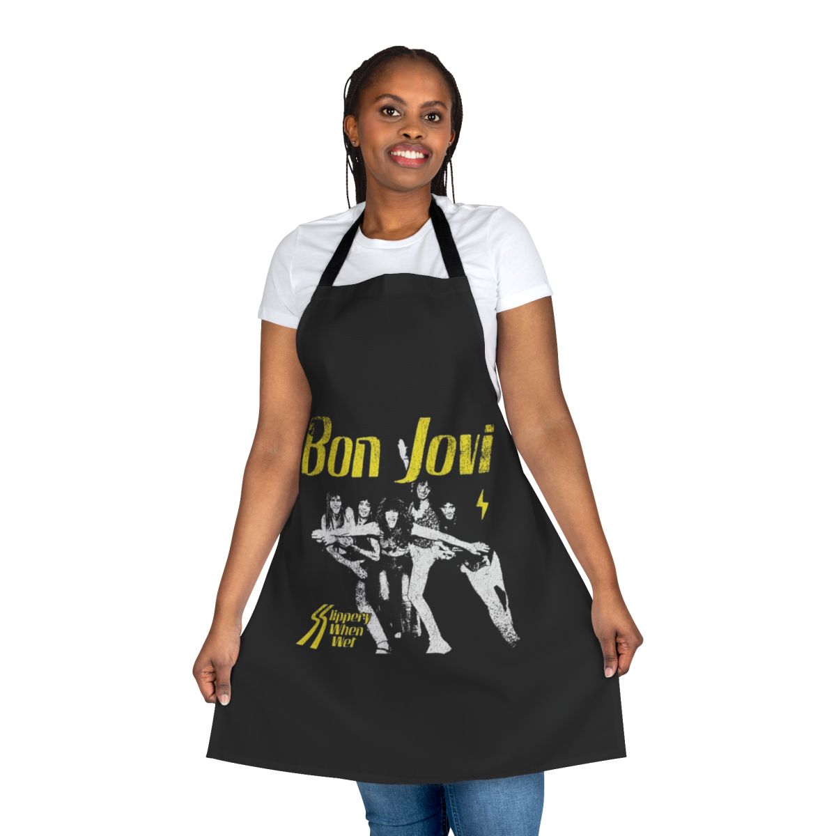 A black cooking apron featuring a heart dagger design, inspired by the Bon Jovi album "Slippery When Wet"
