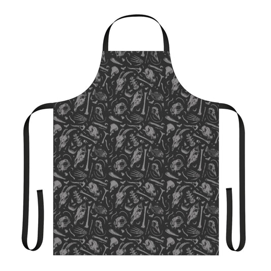 A denim apron featuring a dark, gothic skull pattern design.