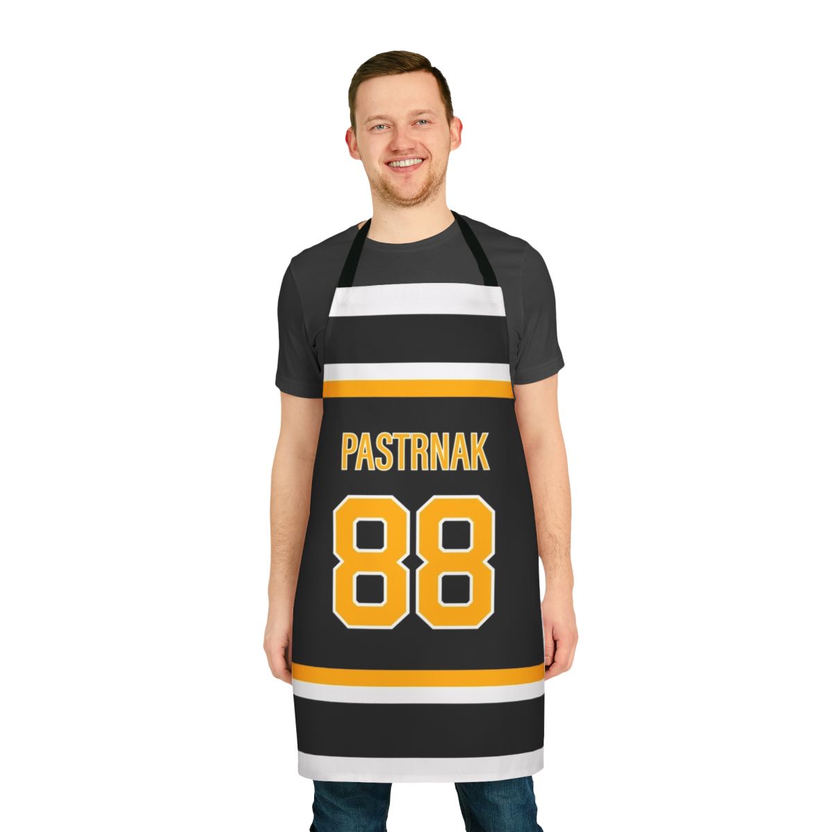Cooking apron featuring the jersey design of Boston Bruins hockey player David Pastrnak