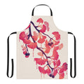 A beautiful apron featuring a surreal watercolor design of ginkgo leaves and flowers in shades of pink and purple.